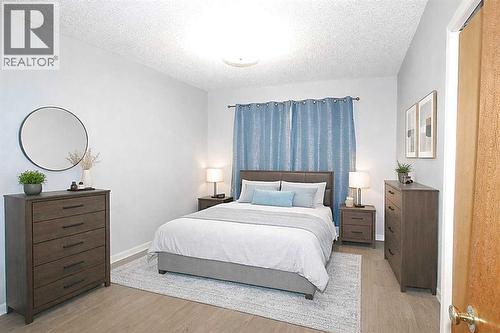virtually staged - 97 Cunningham Crescent, Red Deer, AB - Indoor Photo Showing Bedroom