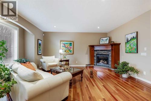 47 Tuscany Estates Close Nw, Calgary, AB - Indoor Photo Showing Living Room With Fireplace
