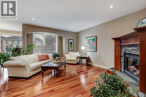 47 Tuscany Estates Close Nw, Calgary, AB - Indoor Photo Showing Living Room With Fireplace