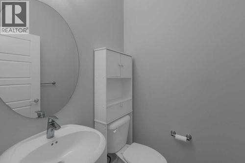 2 piece powder room main floor - 137 Willow Park N, Cochrane, AB - Indoor Photo Showing Bathroom