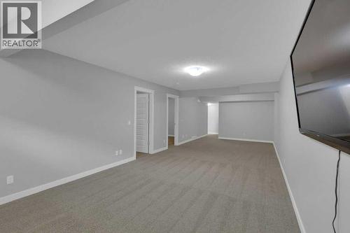Comfortable finished basement - 137 Willow Park N, Cochrane, AB - Indoor Photo Showing Other Room