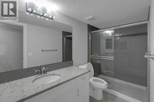 Basement 3 piece bathroom with granite countertops - 137 Willow Park N, Cochrane, AB - Indoor Photo Showing Bathroom