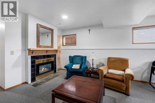 192 Rivercrest Close Se, Calgary, AB - Indoor Photo Showing Living Room With Fireplace
