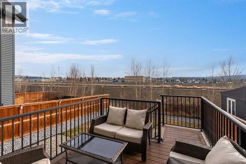 169 Buckskin Way, Cochrane, AB - Outdoor With Deck Patio Veranda With Exterior