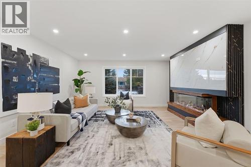 11039 Brae Road Sw, Calgary, AB - Indoor Photo Showing Living Room With Fireplace