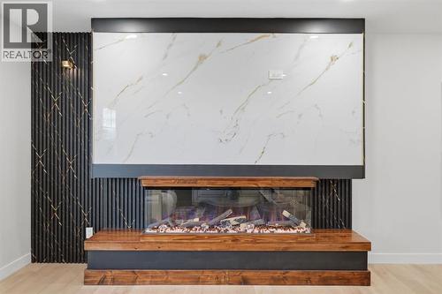 11039 Brae Road Sw, Calgary, AB - Indoor Photo Showing Other Room With Fireplace
