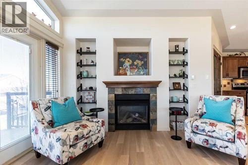 6371 Cedar Way, Innisfail, AB - Indoor Photo Showing Living Room With Fireplace
