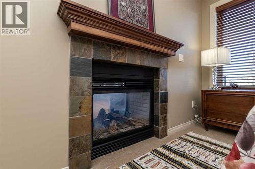 6371 Cedar Way, Innisfail, AB - Indoor With Fireplace