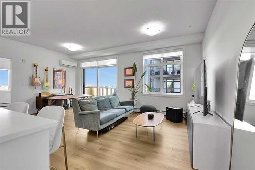 2216, 200 Seton Circle Se, Calgary, AB - Indoor Photo Showing Living Room