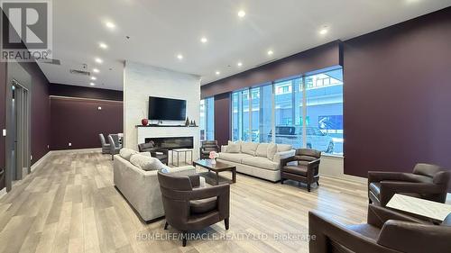 607 - 560 North Service Road, Grimsby, ON - Indoor Photo Showing Living Room With Fireplace