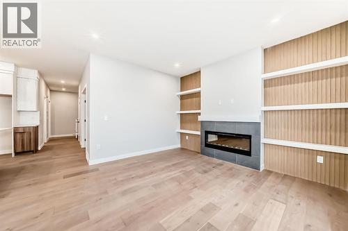 508 Heritage Boulevard, Cochrane, AB - Indoor Photo Showing Living Room With Fireplace