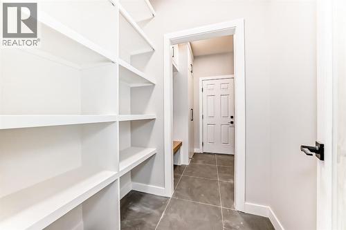 Pantry with built in's - 508 Heritage Boulevard, Cochrane, AB - Indoor With Storage