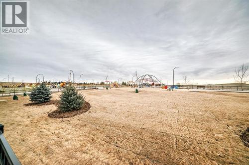 Steps from playgrond and green space - 508 Heritage Boulevard, Cochrane, AB - Outdoor With View