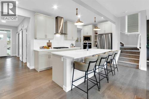 287 Rivercrest Boulevard, Cochrane, AB - Indoor Photo Showing Kitchen With Upgraded Kitchen