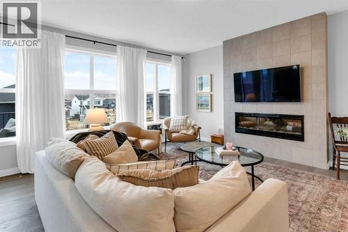 287 Rivercrest Boulevard, Cochrane, AB - Indoor Photo Showing Living Room With Fireplace