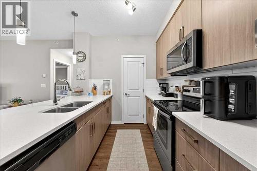 302, 200 Cranfield Common Se, Calgary, AB - Indoor Photo Showing Kitchen With Double Sink With Upgraded Kitchen