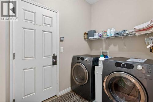 Garage Entry and Laundry - 627 Auburn Bay Heights Se, Calgary, AB - Indoor Photo Showing Laundry Room