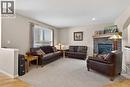 Living Room - 627 Auburn Bay Heights Se, Calgary, AB  - Indoor Photo Showing Living Room With Fireplace 