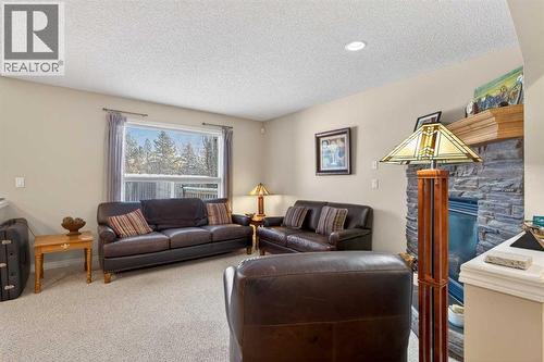 Living Room - 627 Auburn Bay Heights Se, Calgary, AB - Indoor Photo Showing Living Room With Fireplace