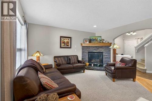 Living Room - 627 Auburn Bay Heights Se, Calgary, AB - Indoor Photo Showing Living Room With Fireplace