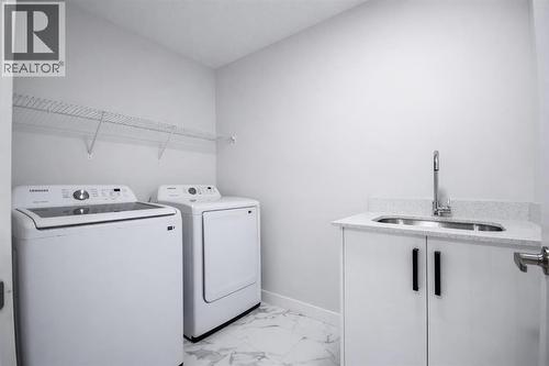 113 Corner Meadows Square Ne, Calgary, AB - Indoor Photo Showing Laundry Room