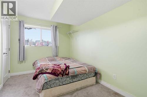 80 Taradale Drive S, Calgary, AB - Indoor Photo Showing Bedroom