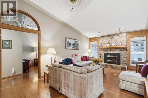 1025 Shawnee Road Sw, Calgary, AB - Indoor Photo Showing Living Room With Fireplace