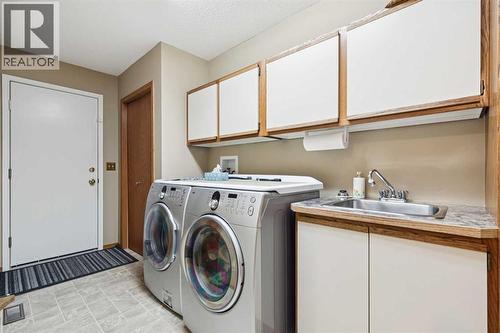 1025 Shawnee Road Sw, Calgary, AB - Indoor Photo Showing Laundry Room