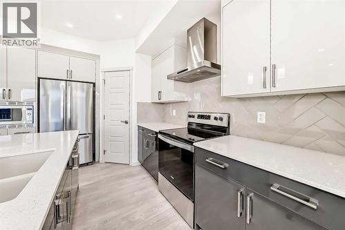 31 Lucas Passage Nw, Calgary, AB - Indoor Photo Showing Kitchen With Upgraded Kitchen