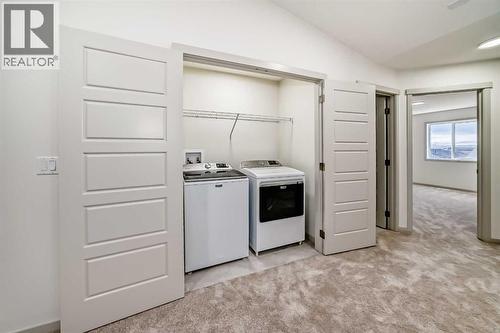 31 Lucas Passage Nw, Calgary, AB - Indoor Photo Showing Laundry Room