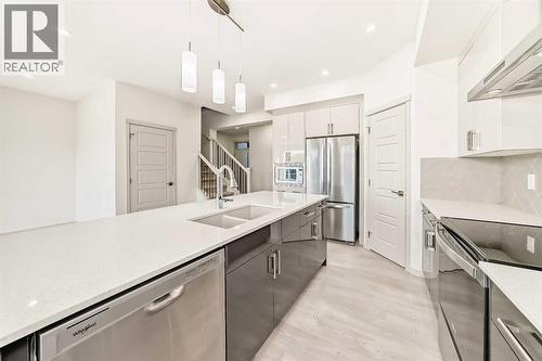31 Lucas Passage Nw, Calgary, AB - Indoor Photo Showing Kitchen With Double Sink With Upgraded Kitchen