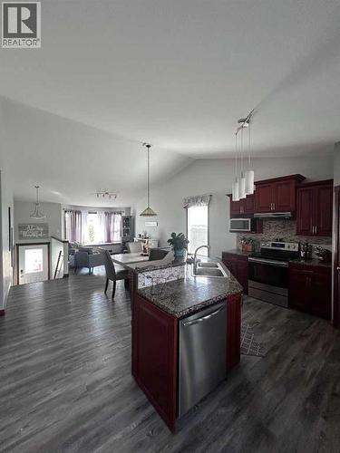 223 15 Street E, Brooks, AB - Indoor Photo Showing Kitchen With Double Sink