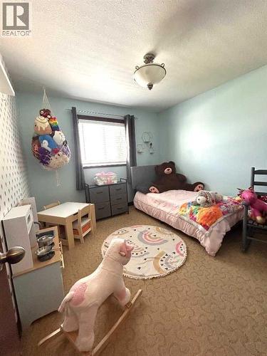 223 15 Street E, Brooks, AB - Indoor Photo Showing Bedroom