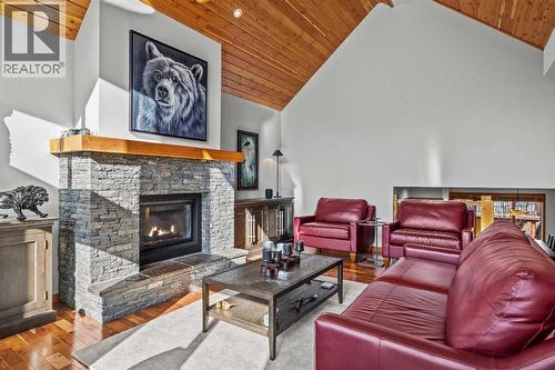 7 Creekside Mews, Canmore, AB - Indoor Photo Showing Living Room With Fireplace