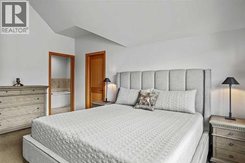 7 Creekside Mews, Canmore, AB - Indoor Photo Showing Bedroom