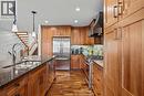 7 Creekside Mews, Canmore, AB  - Indoor Photo Showing Kitchen With Double Sink With Upgraded Kitchen 