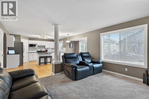 69 Elkton Way Sw, Calgary, AB - Indoor Photo Showing Living Room
