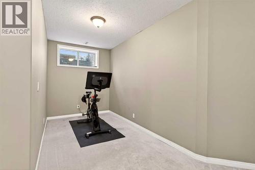 69 Elkton Way Sw, Calgary, AB - Indoor Photo Showing Gym Room
