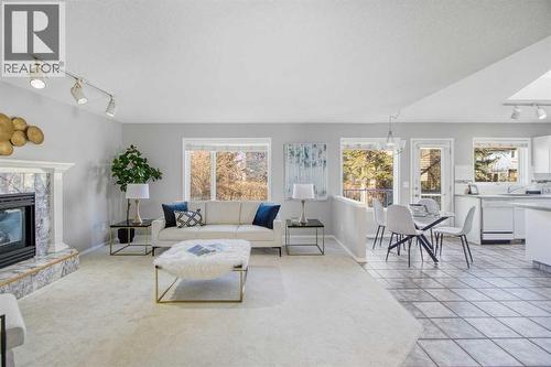 134 Hamptons Heath Nw, Calgary, AB - Indoor Photo Showing Living Room With Fireplace