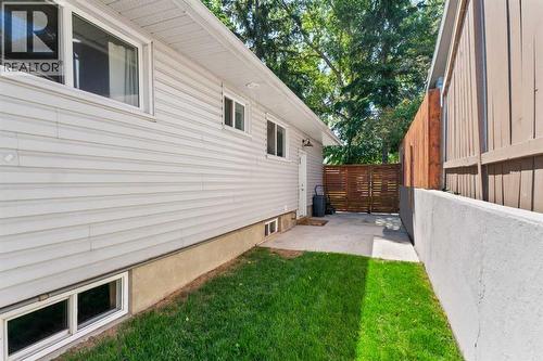 Backyard Entrance - 321 Haddon Road Sw, Calgary, AB - Outdoor With Exterior