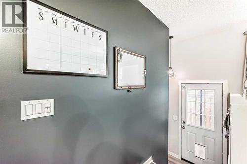 let's head downstairs, side door entry - 12 Taraglen Road Ne, Calgary, AB - Indoor Photo Showing Other Room