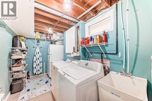 laundry on lower - 12 Taraglen Road Ne, Calgary, AB - Indoor Photo Showing Laundry Room