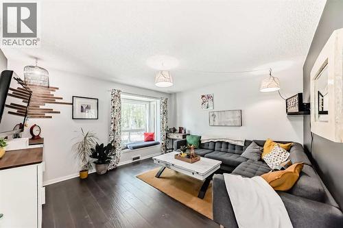 living room (front of house) window seating - 12 Taraglen Road Ne, Calgary, AB - Indoor Photo Showing Living Room