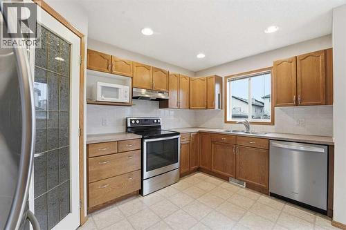 905 Arbour Lake Road Nw, Calgary, AB - Indoor Photo Showing Kitchen With Stainless Steel Kitchen With Double Sink