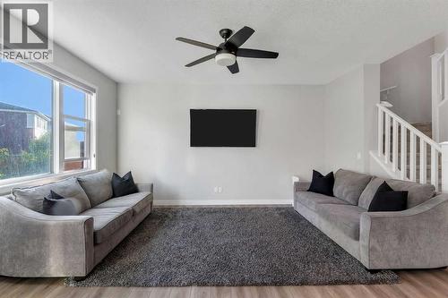 39 Savanna Way Ne, Calgary, AB - Indoor Photo Showing Living Room With Fireplace