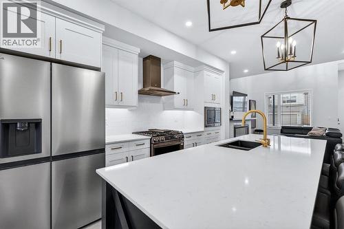 413 Belmont Park Sw, Calgary, AB - Indoor Photo Showing Kitchen With Stainless Steel Kitchen With Double Sink With Upgraded Kitchen