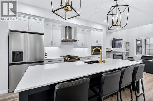 413 Belmont Park Sw, Calgary, AB - Indoor Photo Showing Kitchen With Stainless Steel Kitchen With Double Sink With Upgraded Kitchen
