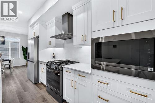 413 Belmont Park Sw, Calgary, AB - Indoor Photo Showing Kitchen With Stainless Steel Kitchen With Upgraded Kitchen