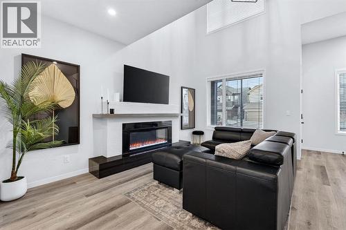 413 Belmont Park Sw, Calgary, AB - Indoor Photo Showing Living Room With Fireplace
