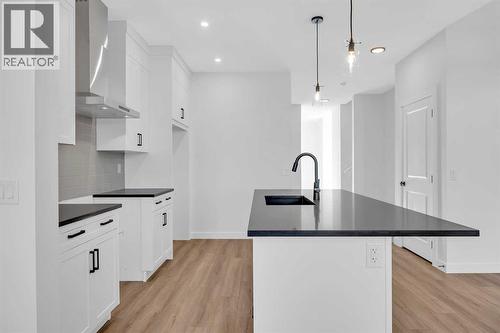 14 Versant Path Sw, Calgary, AB - Indoor Photo Showing Kitchen With Upgraded Kitchen